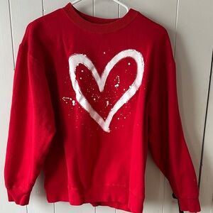 Women's red sweatshirt with a heart